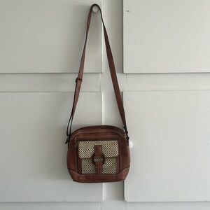 Women’s crossbody. Vinyl body, vinyl trim, polyester lining. Like new